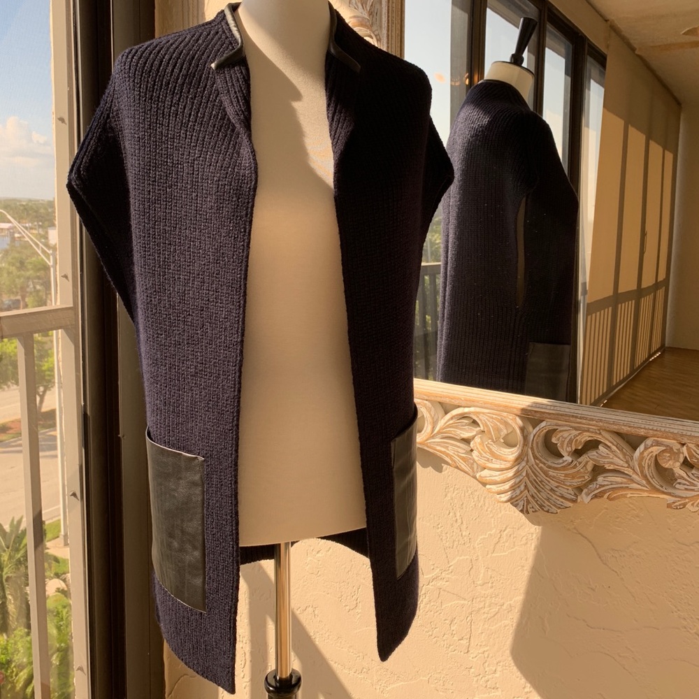 Navy sweater vest with leather trim and pockets